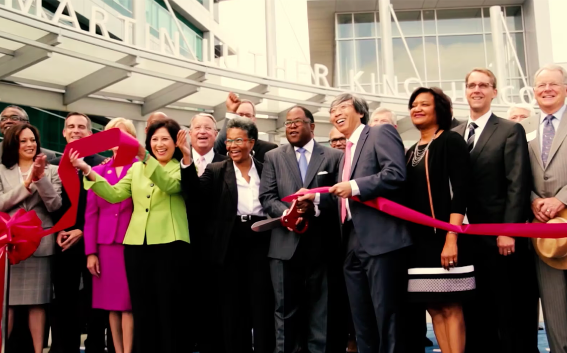 Group photo of ribbon cutting from MLKCH opening day ceremony