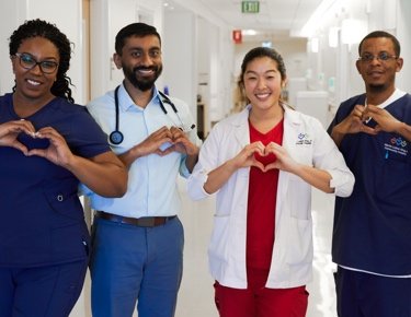 Nurses and doctors with heart hands