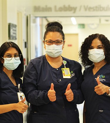 Three nurses with thumbs up