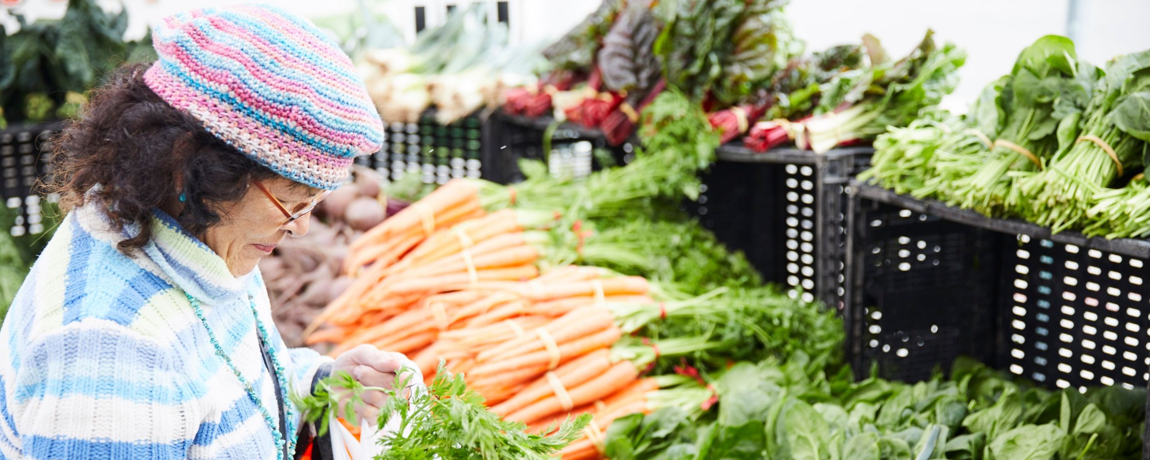 Photo of African American woman shopping for vegetables