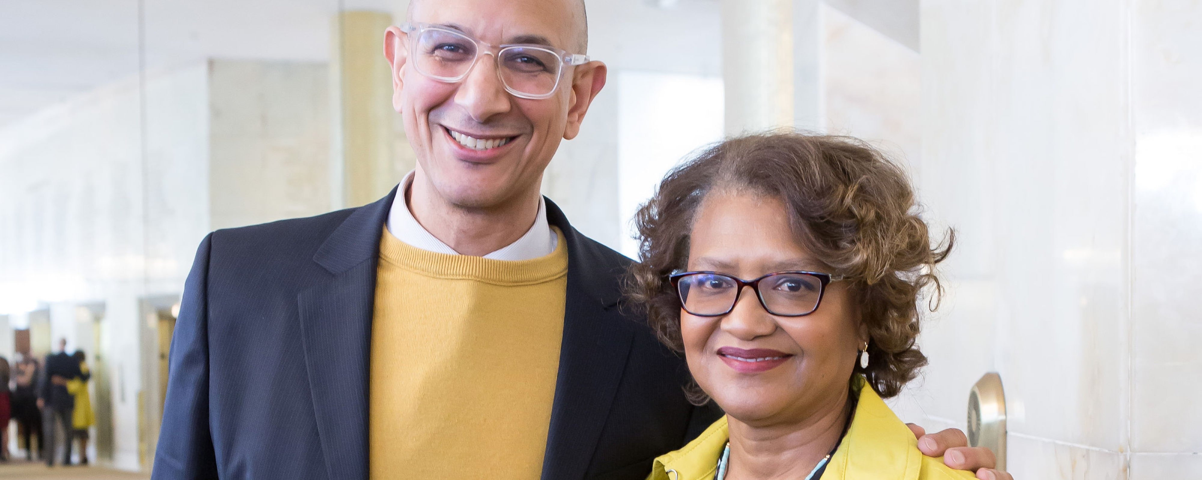 Dr. Mark Ghaly, a middle-aged white man, standing next to Dr. Batchlor, a middle-aged Black woman, at the Dream Lunch