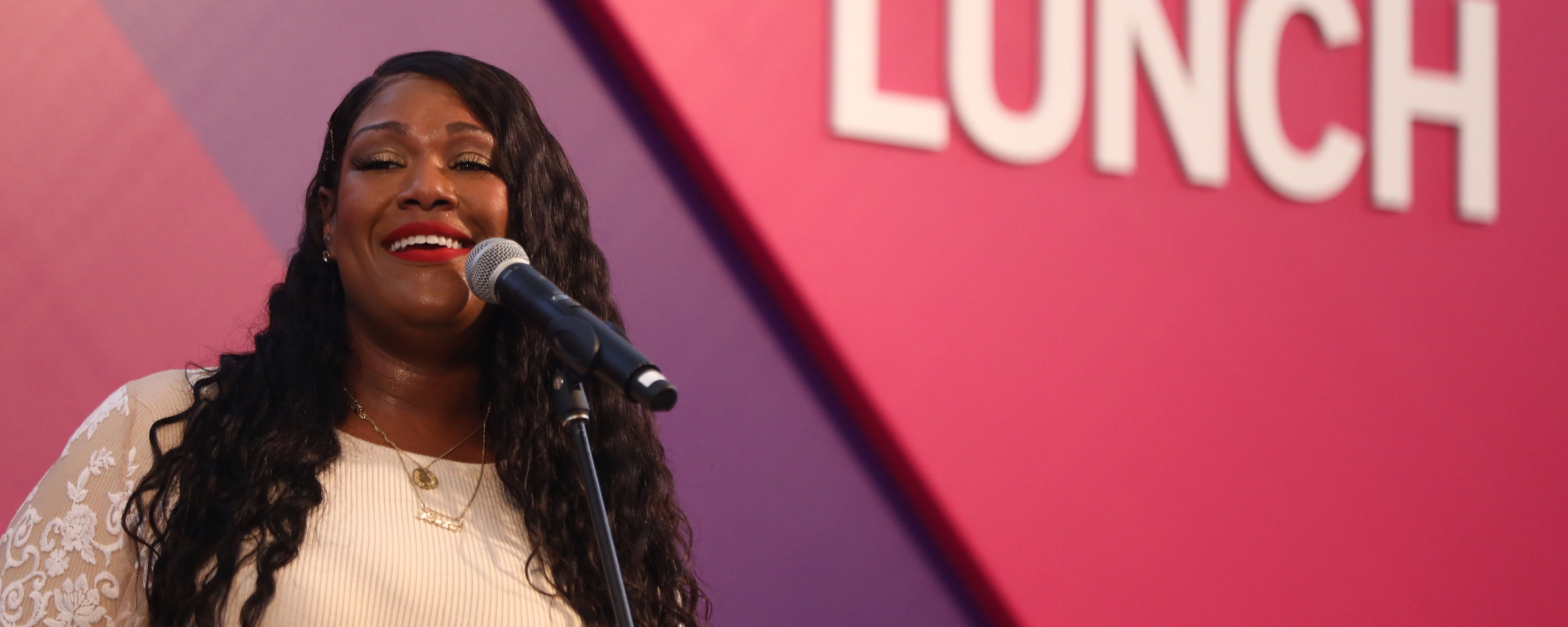 Close up of singer Keisha Renee, a young Black woman, singing on stage