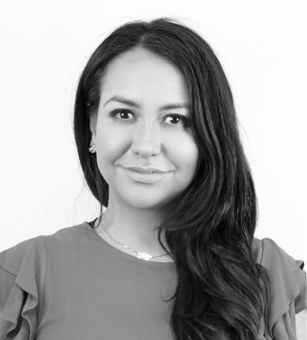 Black and white headshot of Patty Rodriguez, a middle-aged Latina woman